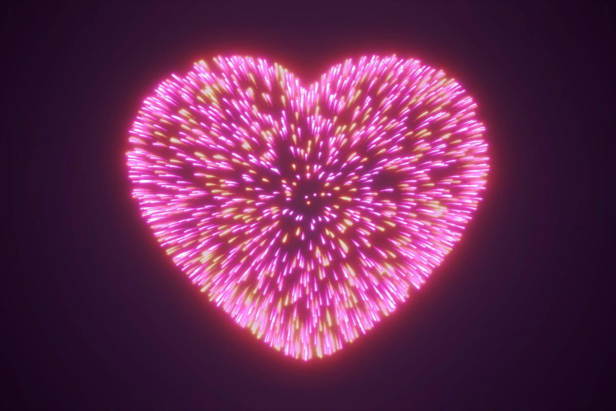 Un feu d'artifice en forme de coeur rose symbolisant l'amour éternel entre deux mariés